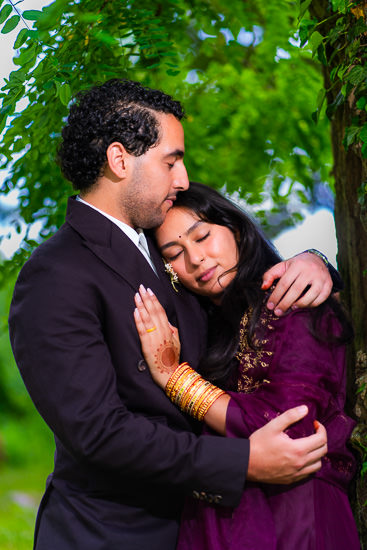 Outdoors closeup portrait of young man and woman they are hugging